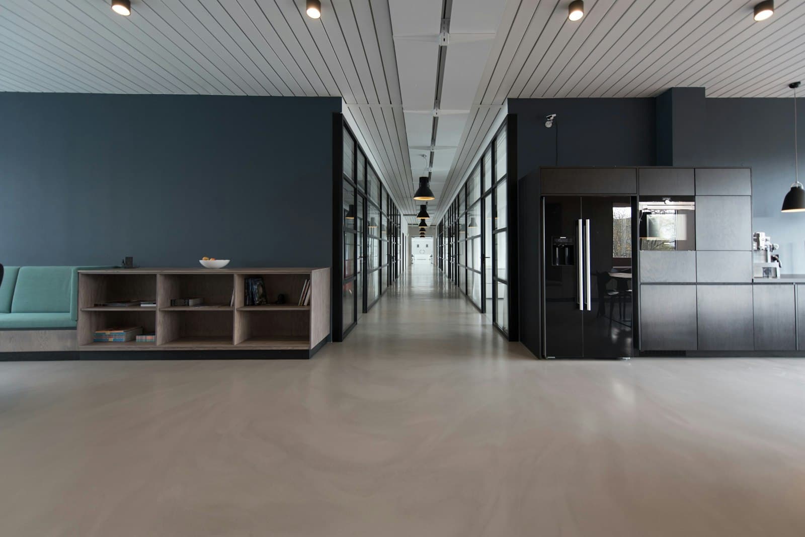 Empty modern office with glass walls and open desks